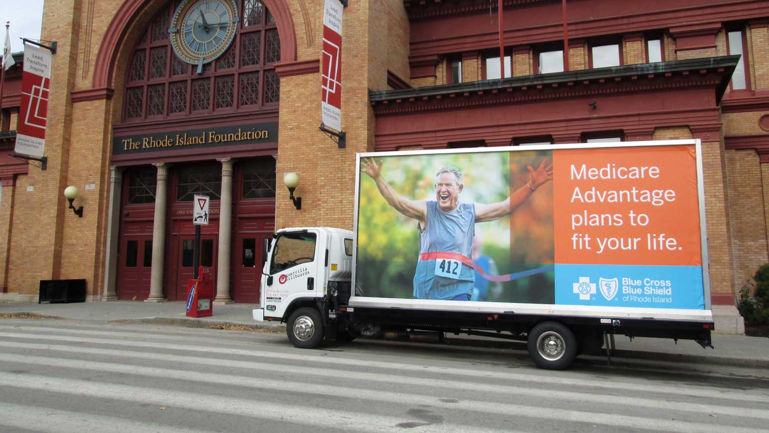 Billboard truck advertising Medicare Advantage in Providence RI