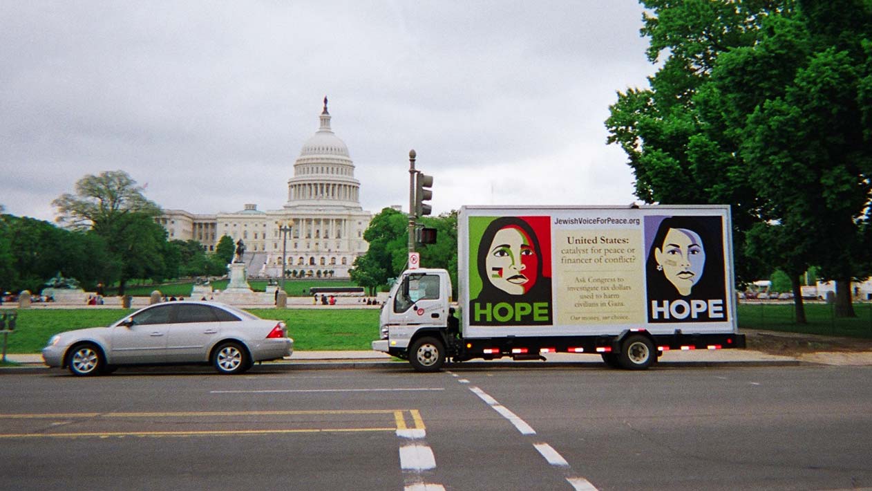 Mobile billboard truck stopped across from the U.S. Capitol in Washington DC.