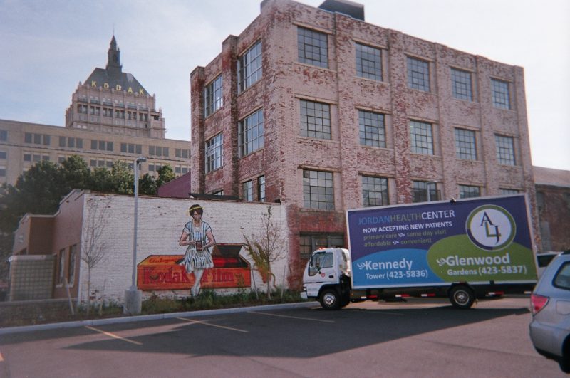 Billboard truck in Rochester NY at iconic handpainted billboard advertising Kodak Film