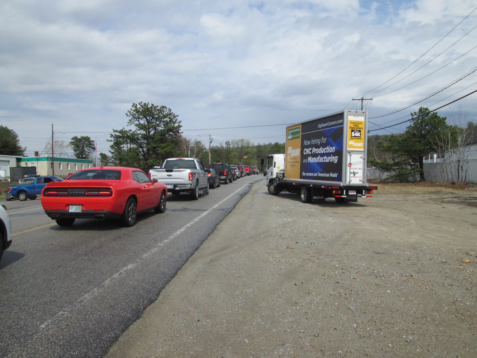 Now Hiring billboard truck ad with shift change traffic in Manchester NH