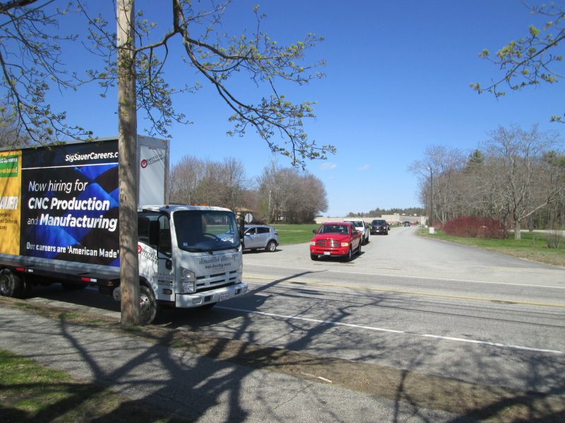 Employee recuiting billboard truck ad with shift change traffic in Southern Maine