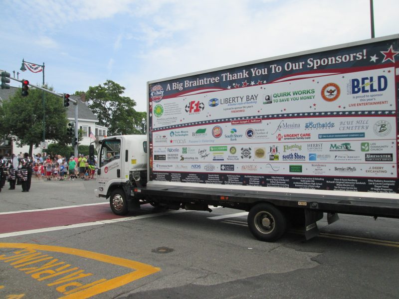 Billboard truck running in a parade with a Thank You Sponsors ad