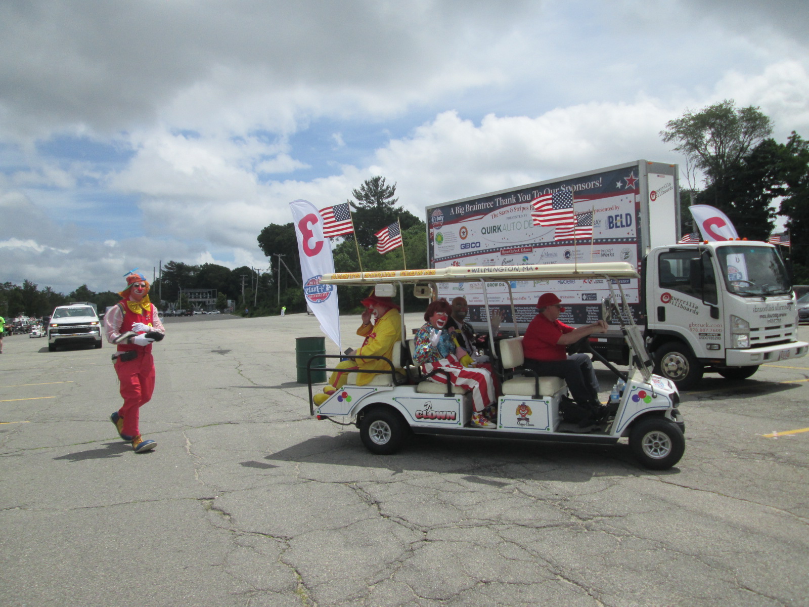 Billboard truck and Shriners Clowns at 2021 Braintree July 4th Parade staging area