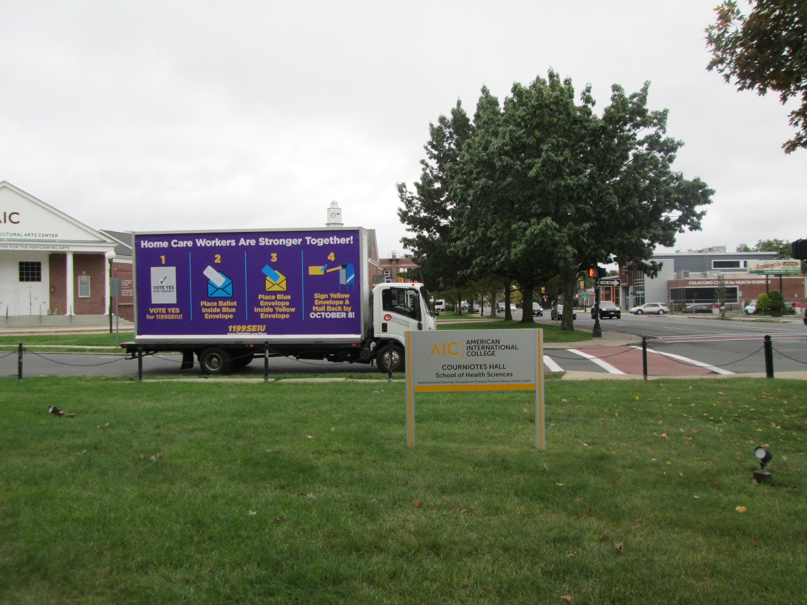 Mobile billboard truck stopped at American International College in Springfield MA