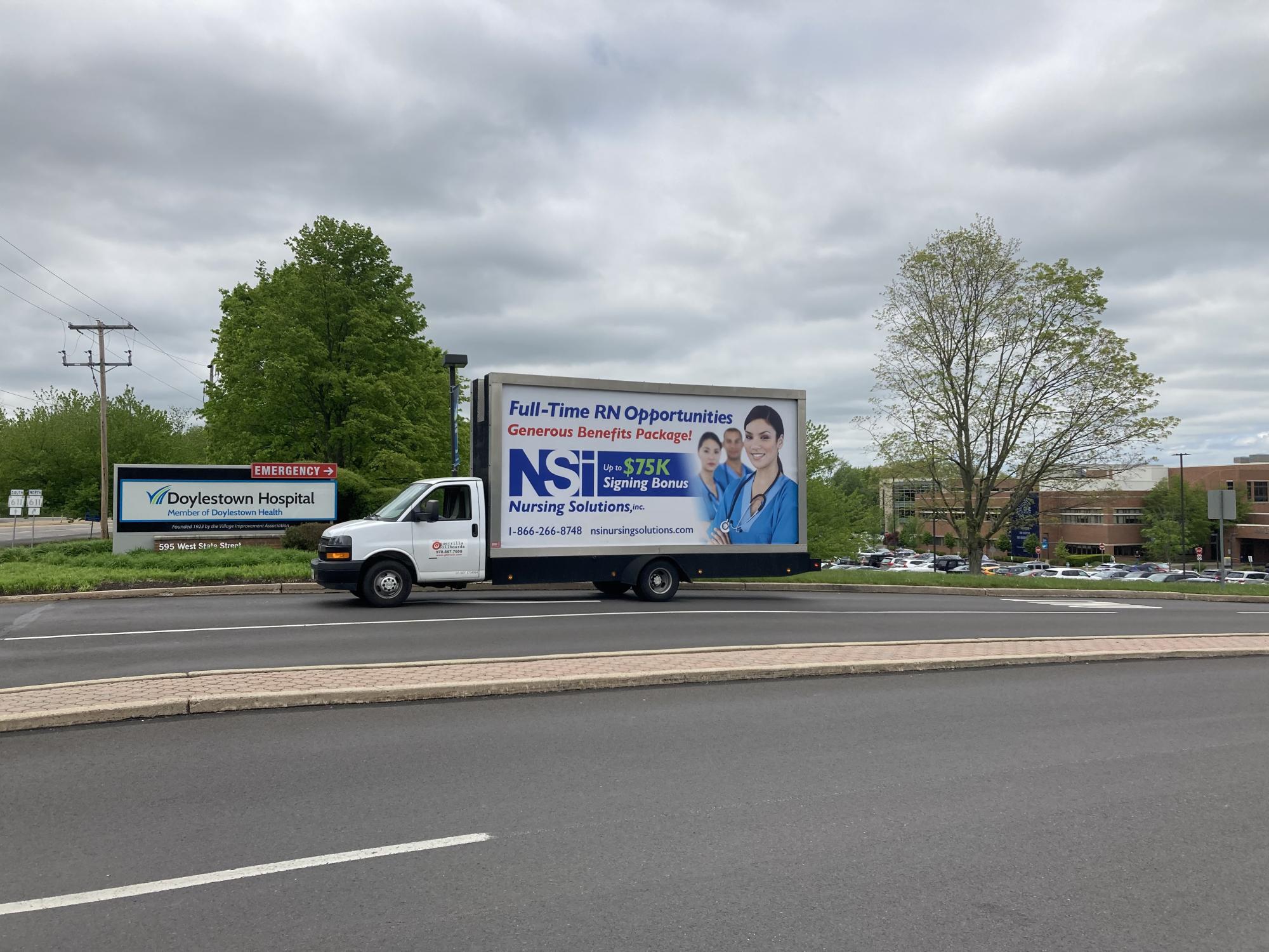 Mobile billboard truck displaying an employee recruiting ad in Doylestown PA
