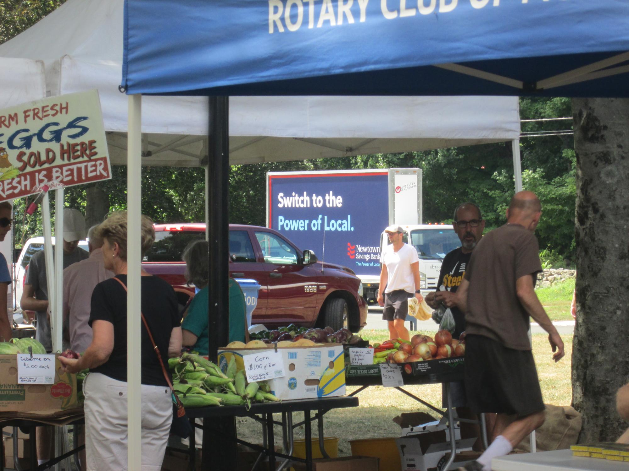 Billboard truck stopped at farmers market in Connecticut, August 2022