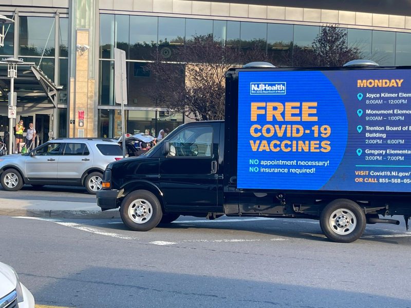 English Covid-19 vaccine ad on a LED mobile billboard truck