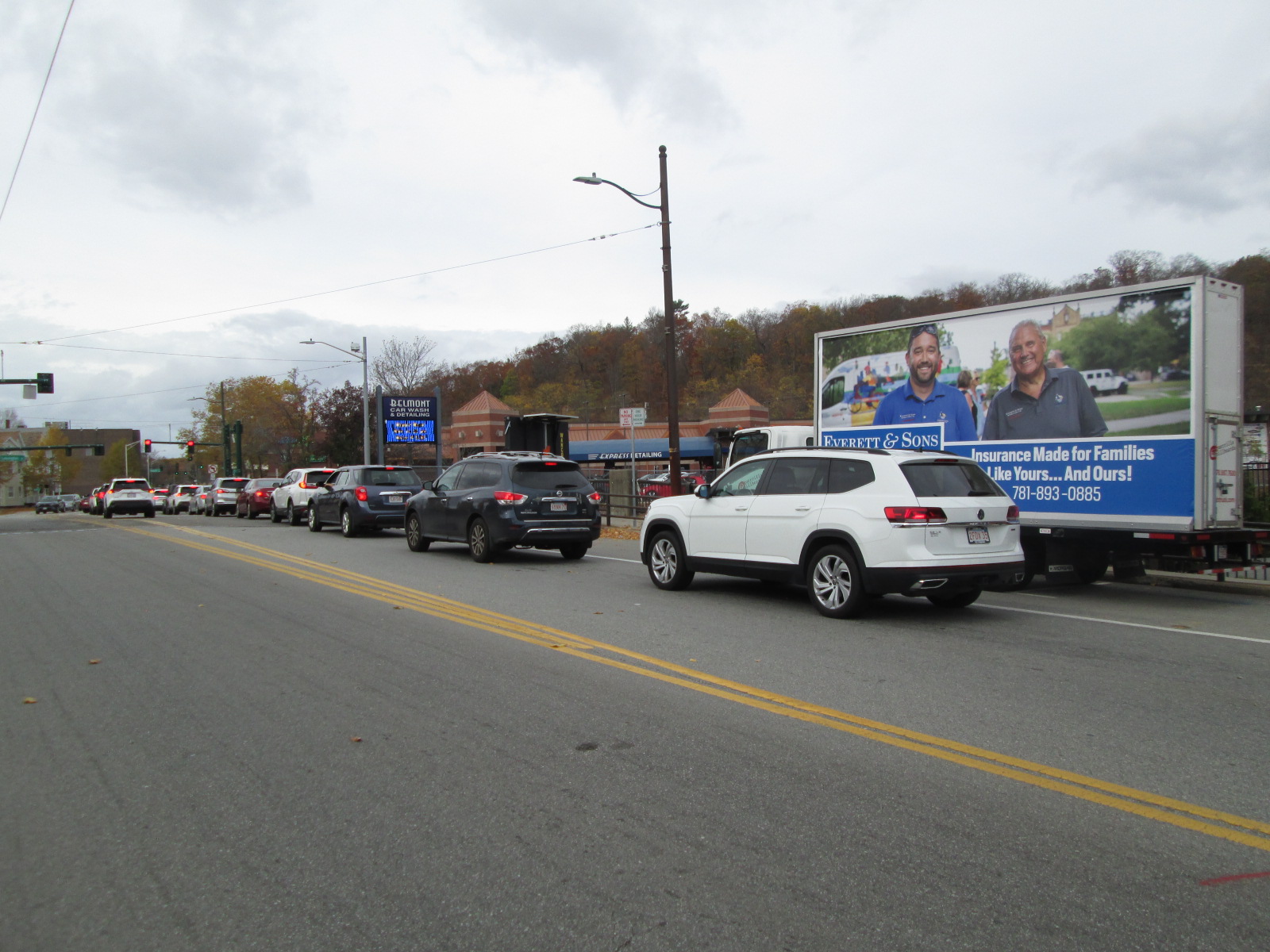 Billboard truck stopped in Waverly Square near Boston MA