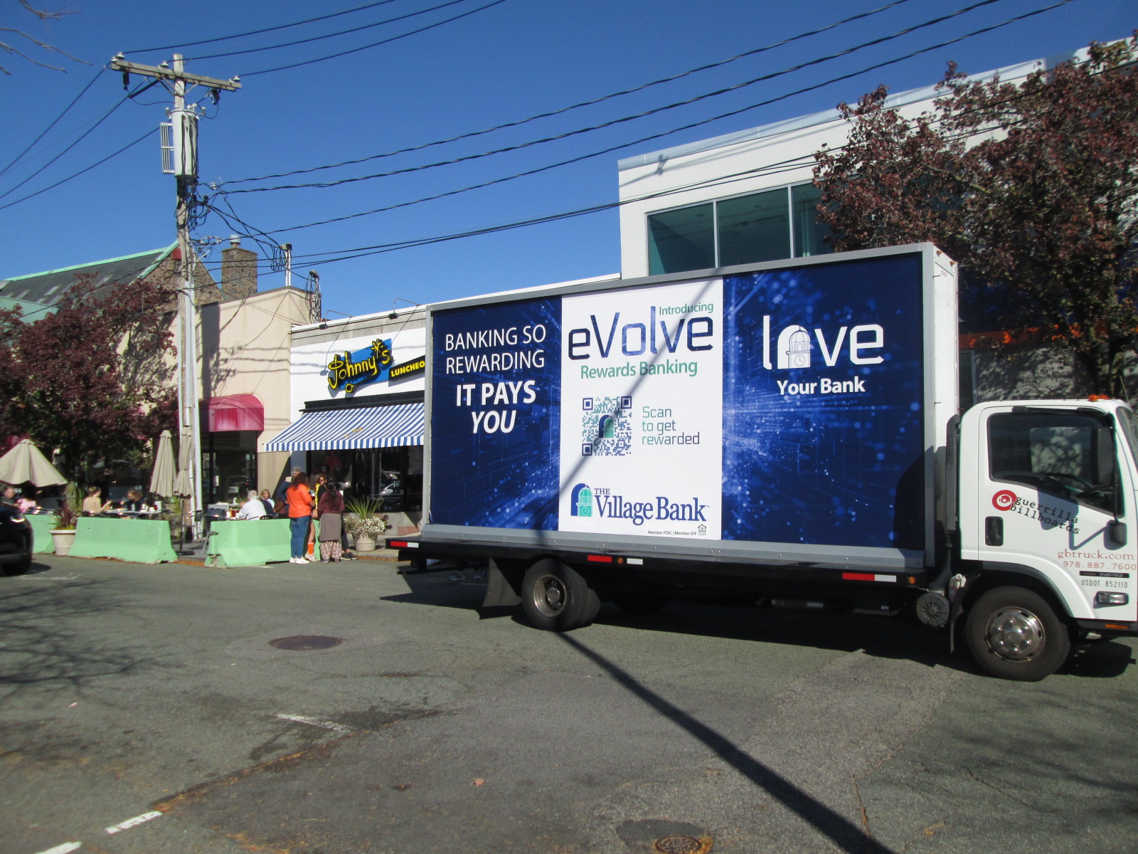 Mobile billboard truck stopped on Langley Road in Newton Centre MA
