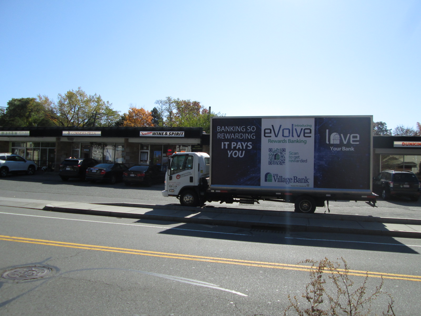 Mobile billboard stopped on Beacon Street in Newton MA