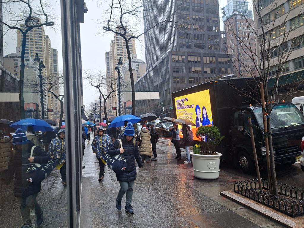 LED Digital mobile billboard truck stopped along New York City's busy 3rd Avenue.