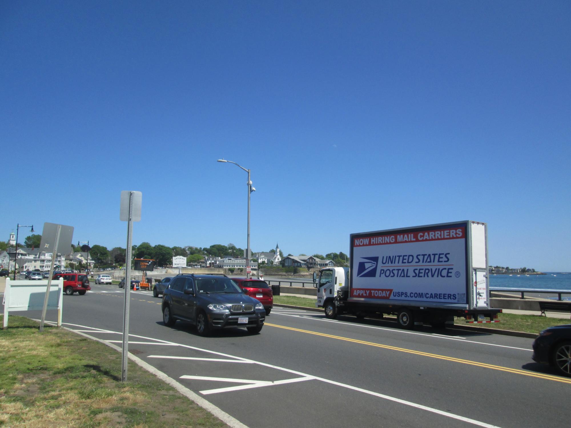 Mobile billboard truck stopped at King's Beach in Swampscott MA.