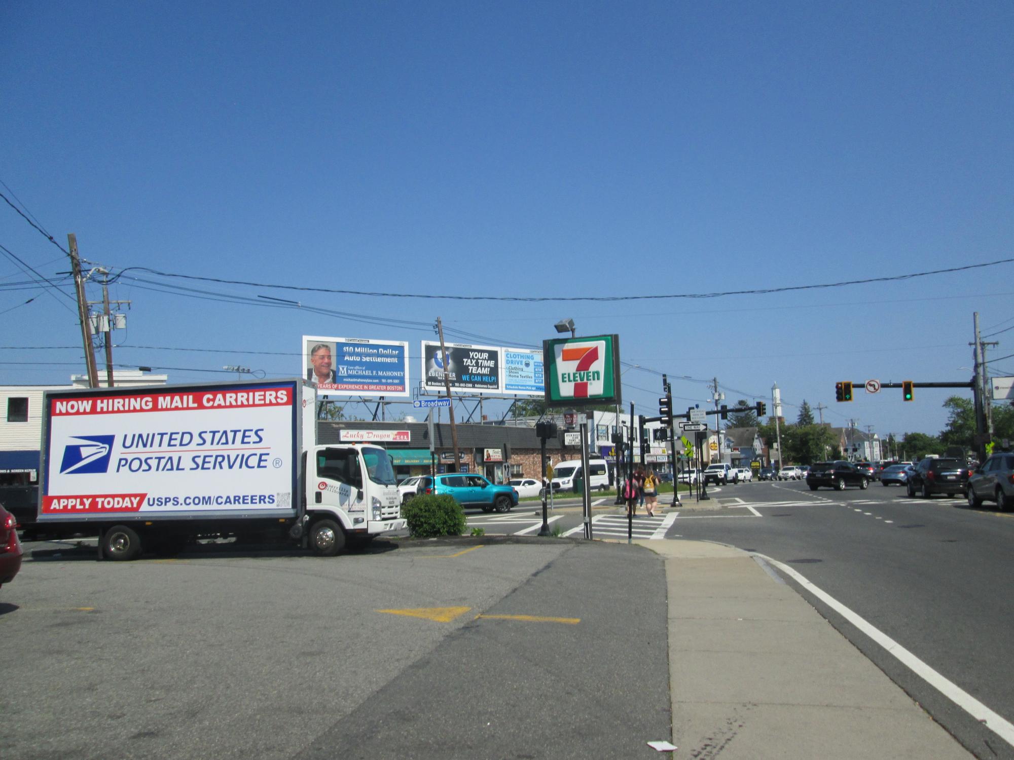 Mobile billboard truck stopped at Wyoma Square in Lynn MA.