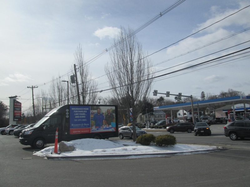 LED billboard truck parked along busy Lexington Street in Waltham MA