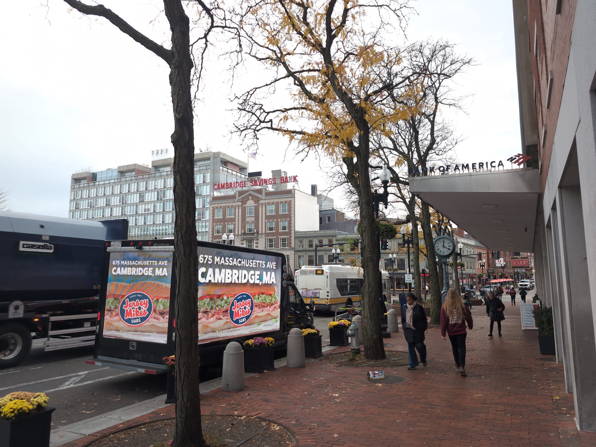 Digital mobile billboard truck stopped in iconic Harvard Square, Cambridge MA.