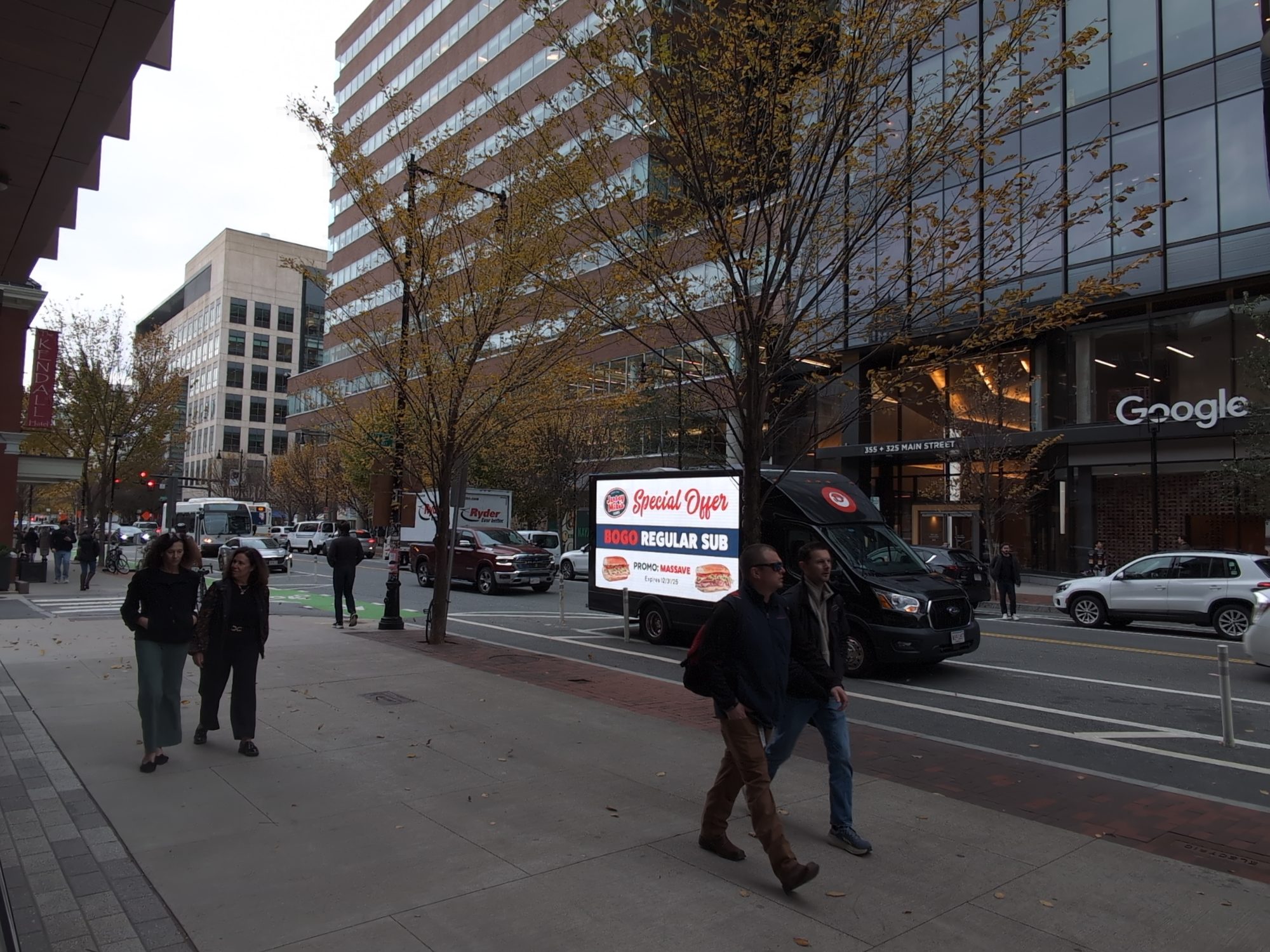 Mobile digital billboard truck advertising Jersey Mike's along Massachusetts Avenue in Cambridge MA.