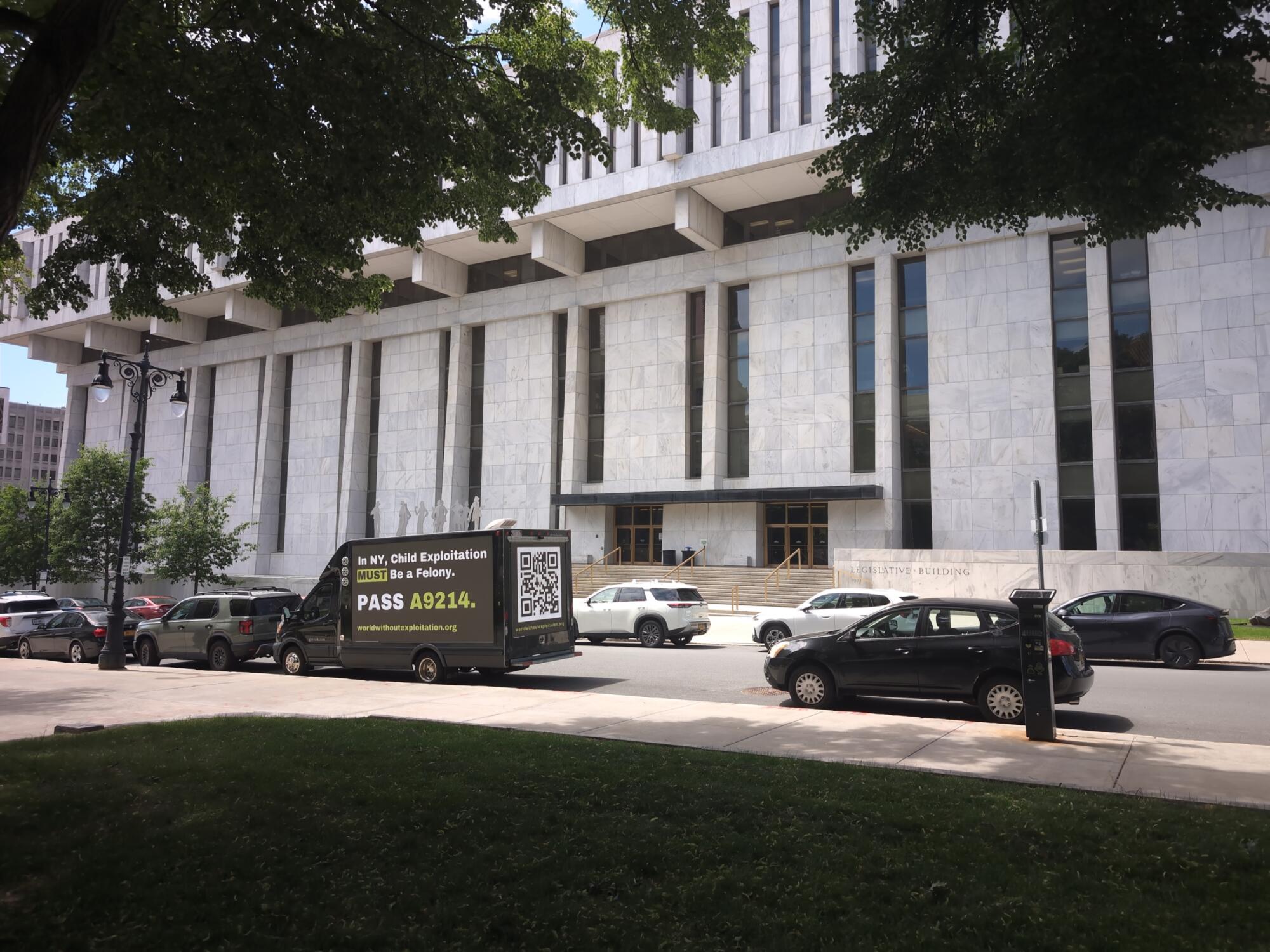 Mobile digital billboard truck parked outside of the New York State Legislative Building in Albany NY.