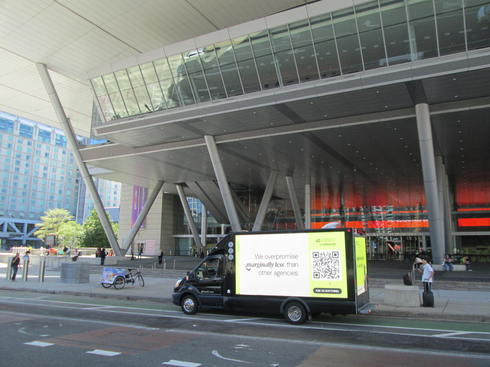 Digital LED billboard truck stopped in front of the Thomas M. Menino Convention & Exhibition Center in Boston MA.